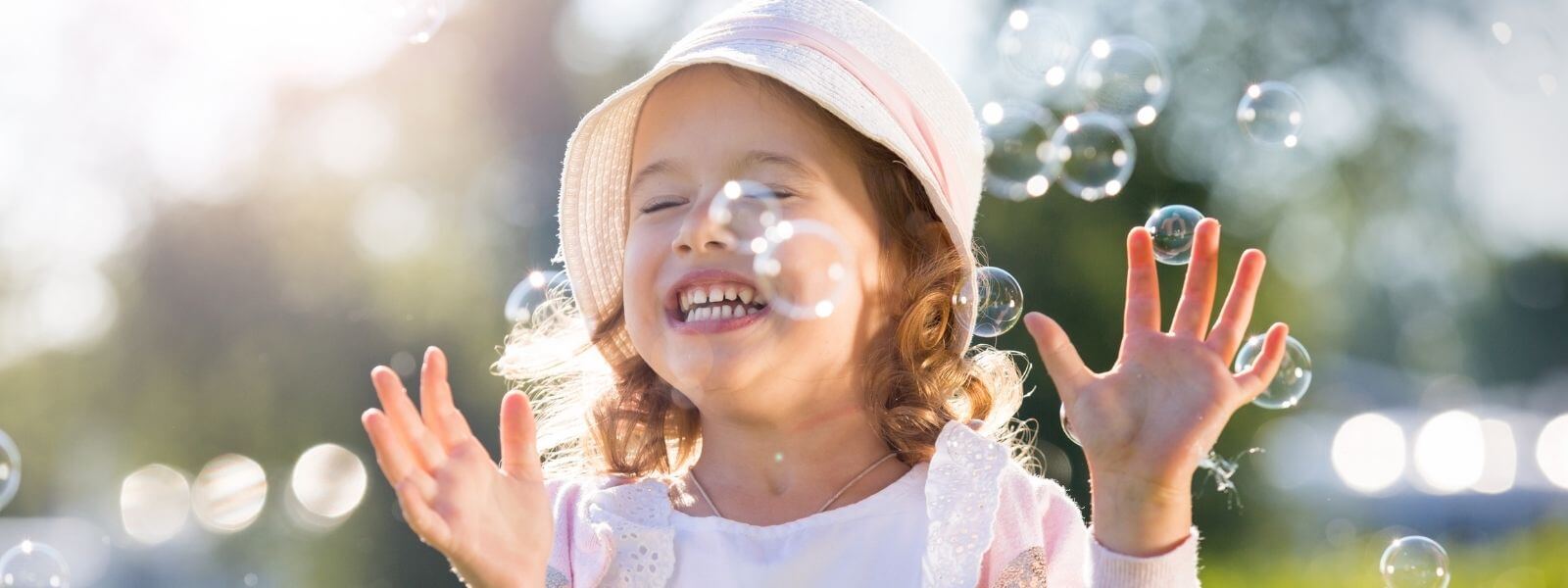Kid playing with bubbles